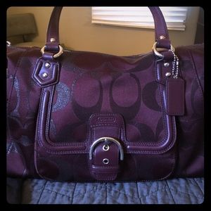 Coach Bag. Plum/Burgundy in color.