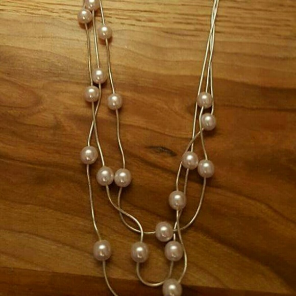 Pale pink pearl necklace with matching earrings