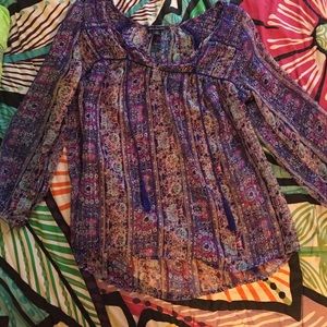 Sheer purple top with silver lines in it!