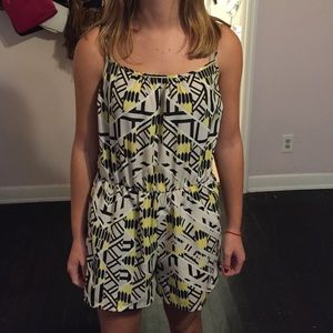 White romper with black and yellow patterns