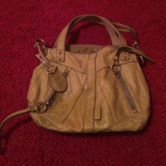 Fossil. Soft leather. Lots of zippers and pockets