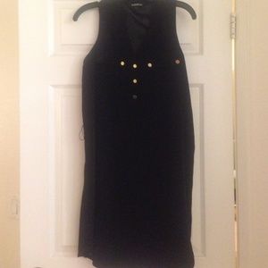 Black sleeveless dress with gold button detail