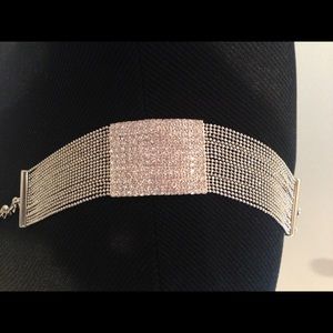 Rhinestone bracelet with liquid silver band.