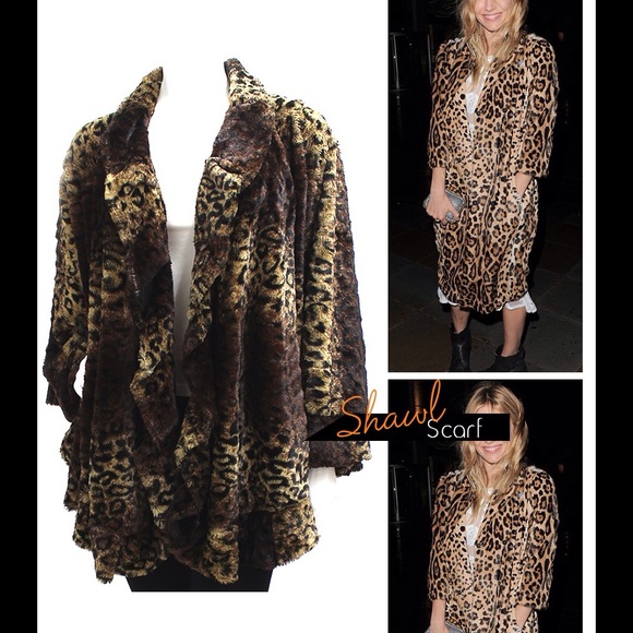 Chic faux fur cape with ruffled trim. NWT