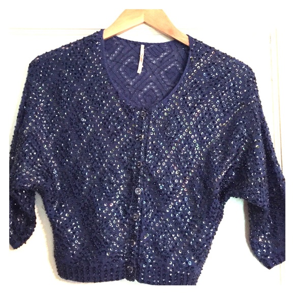Sequined blue sweater from Anthropologie.