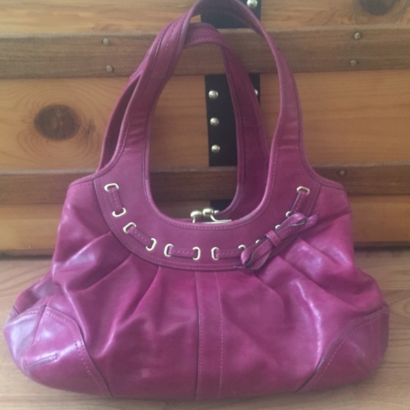 Berry colored leather Coach handbag.