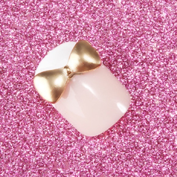 3 3D nail bows gold.