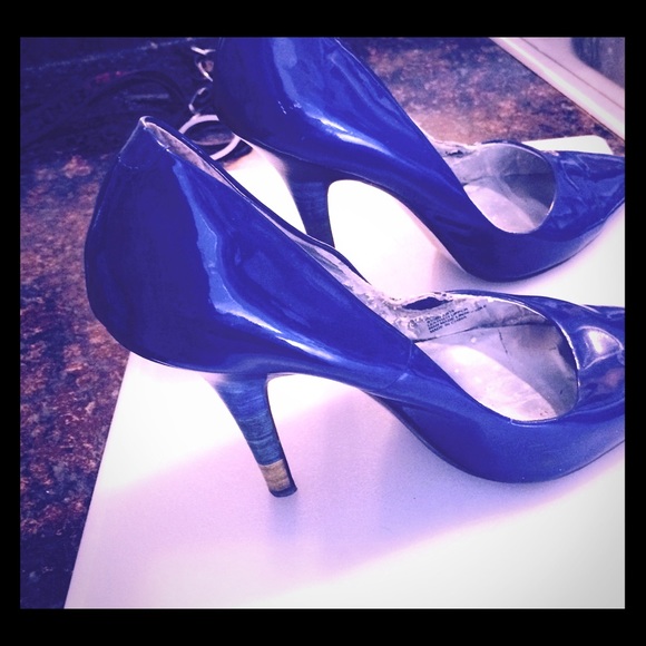 Bright blue high heels.   Unusual heel.