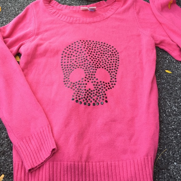 Pink scull sweater.