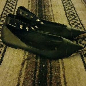 Black flats with spiked ankle strap