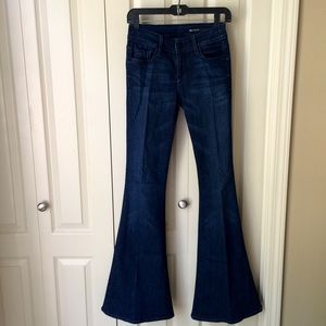 Black Orchid dark wash flared denim.