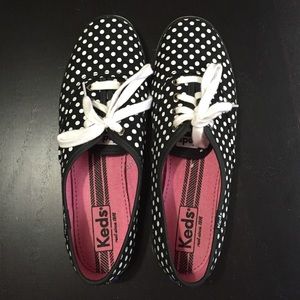 Black and white polka dotted keds