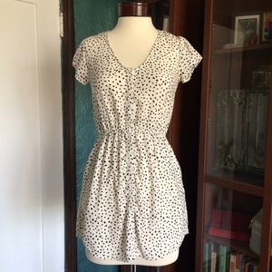 Scoop neck button down dress with all over print.