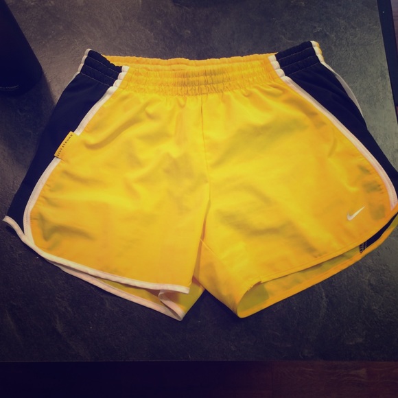 Yellow Nike running shorts