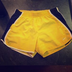 Yellow Nike running shorts