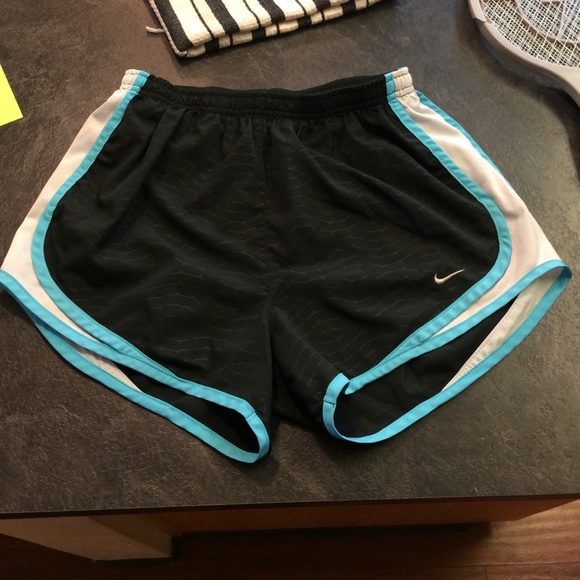 Black and blue nike running shorts