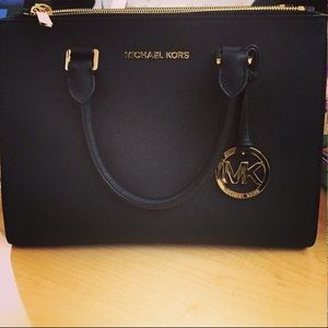 Black and gold Michael Kors bag