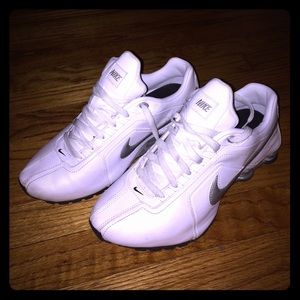 Woman's white Nike Shoxs
