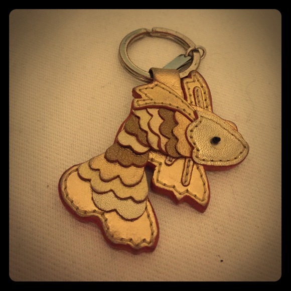 COACH Golden leather goldfish keychain