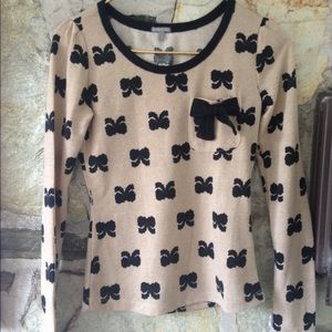 Charlotte Russe Sweaters - Charlotte Russe tan sweater w/ black bows. Sz xs Charlotte Russe Sweaters - Charlotte Russe tan sweater w/ black bows. Sz xs
