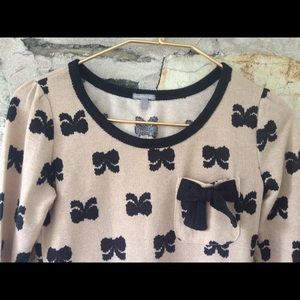Charlotte Russe Sweaters - Charlotte Russe tan sweater w/ black bows. Sz xs Charlotte Russe Sweaters - Charlotte Russe tan sweater w/ black bows. Sz xs