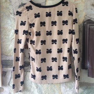 Charlotte Russe Sweaters - Charlotte Russe tan sweater w/ black bows. Sz xs Charlotte Russe Sweaters - Charlotte Russe tan sweater w/ black bows. Sz xs