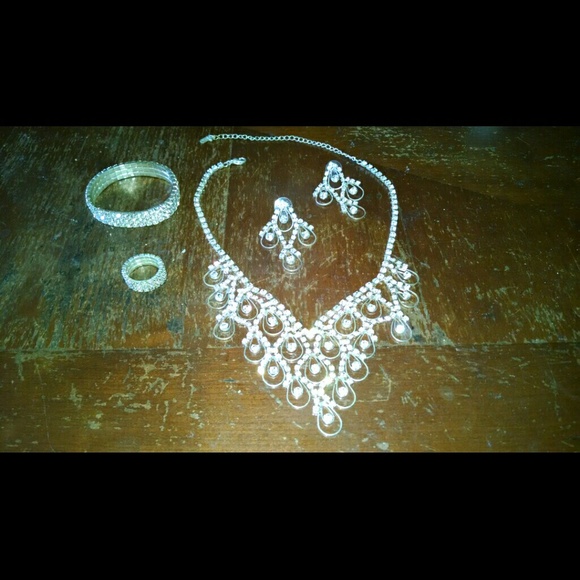 Diamond necklace, earrings, ring and bracelet