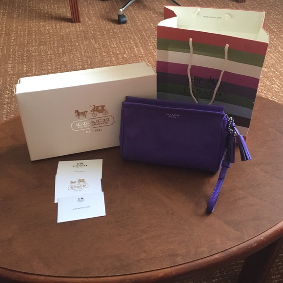 Brand new in box! Purple Leather Coach Wristlet!