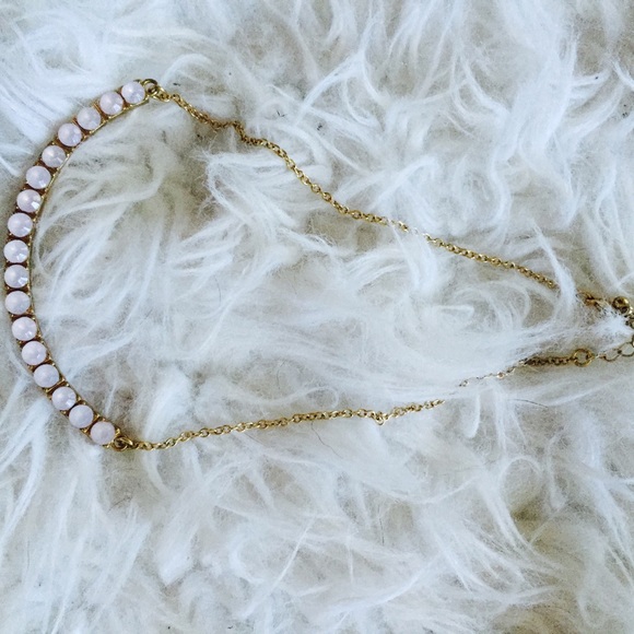 gold necklace with pink stones