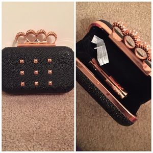 Black and rose gold clutch