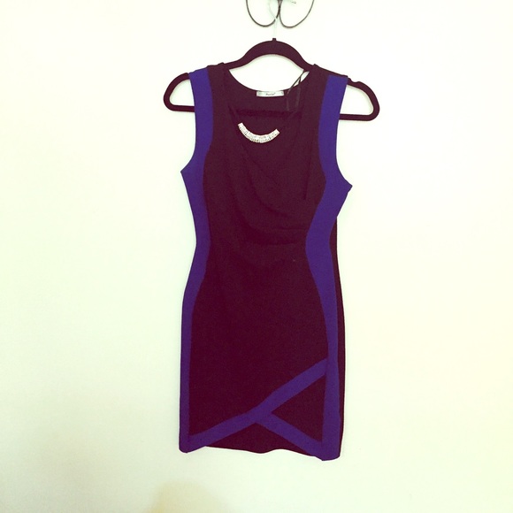 Black and blue dress with studded necklace.