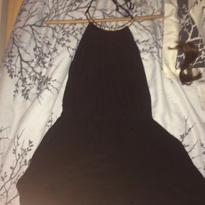 Black romper with gold neck and pockets