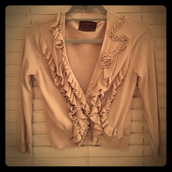Beige decorative cardigan from Anthropologie.