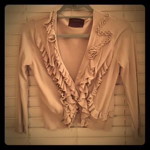 Beige decorative cardigan from Anthropologie.