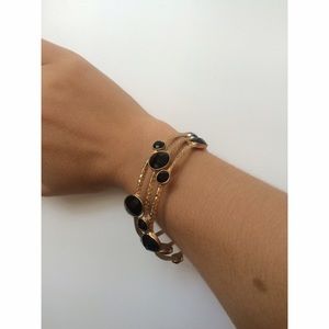 Gold bangle set (3) with black stones