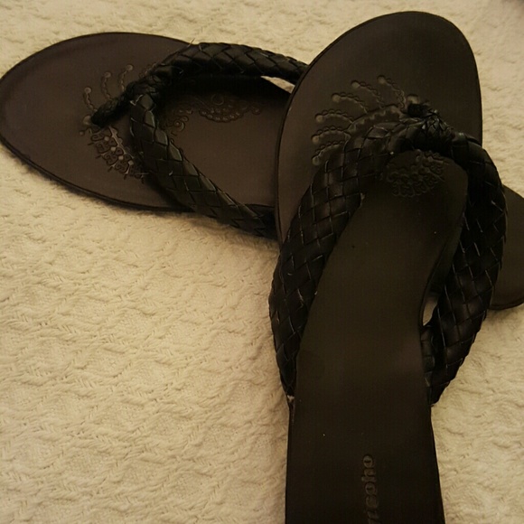 Black leather flip flops