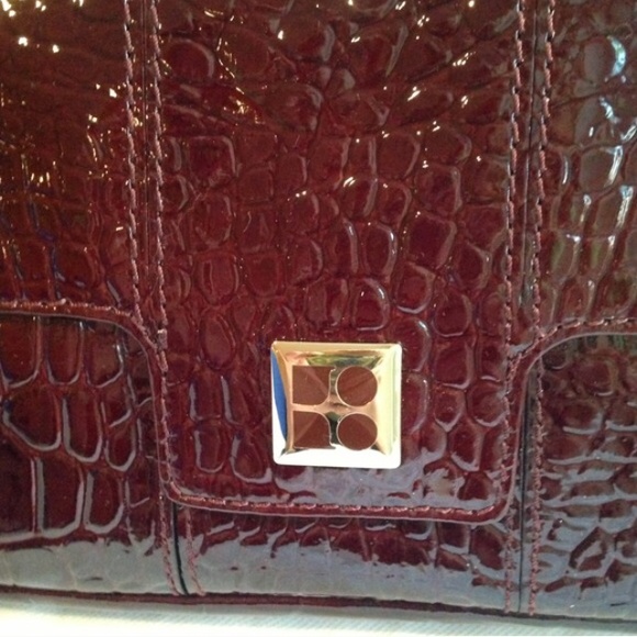 Kate Spade  burgundy patent clutch. never worn