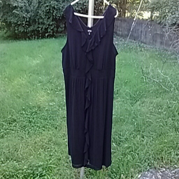 Perfect little black dress. Ruffles down front
