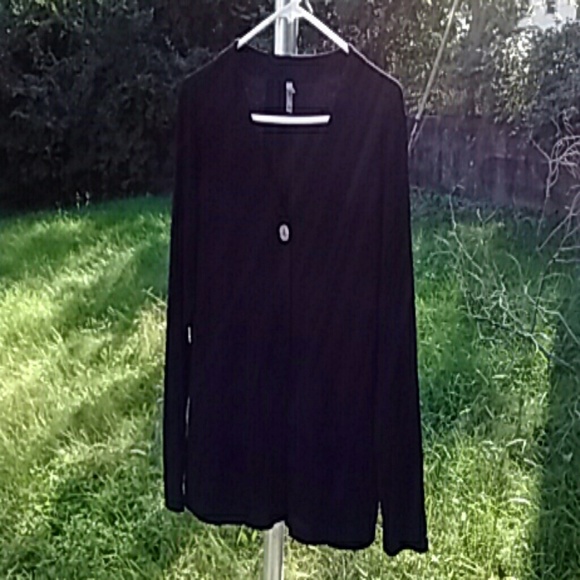 Black, very stretchy jacket with one button. - Picture 1 of 4