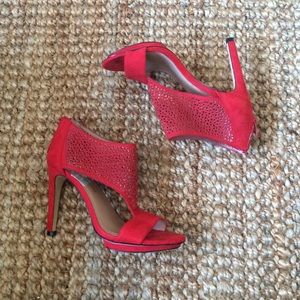 Red suede perforated heels.