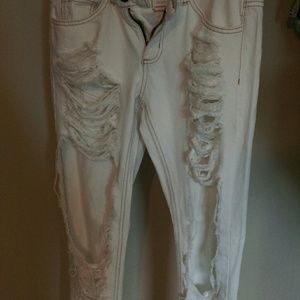 Distressed white jeans