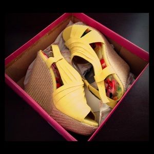 Bright yellow canvas wedge shoes