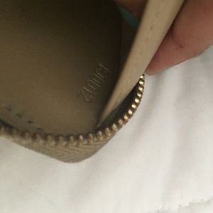 Louis Vuitton zipper wallet.