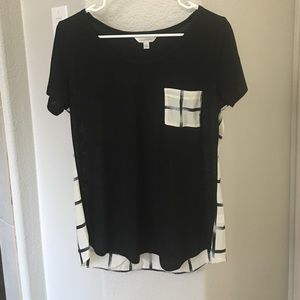 Adorable top with plaid pocket and backing