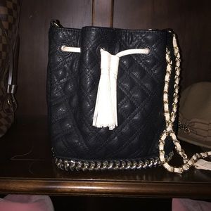 Beautifully made black quilted handbag. NWT