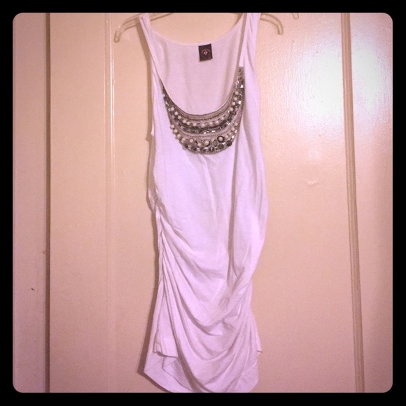 White tank with silver embellishment.