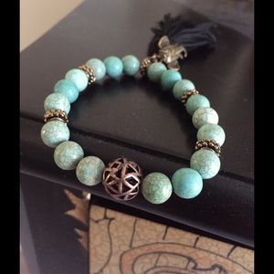 Turquoise ceramic beads with tassel & elephant