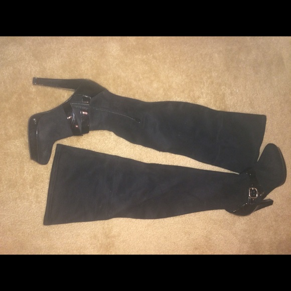 JLO knee high black boots.