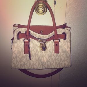 Vanilla Logo/Gold Michael Kors purse.