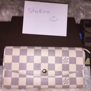 SoldAuthentic Louis Vuitton Emilie wallet
